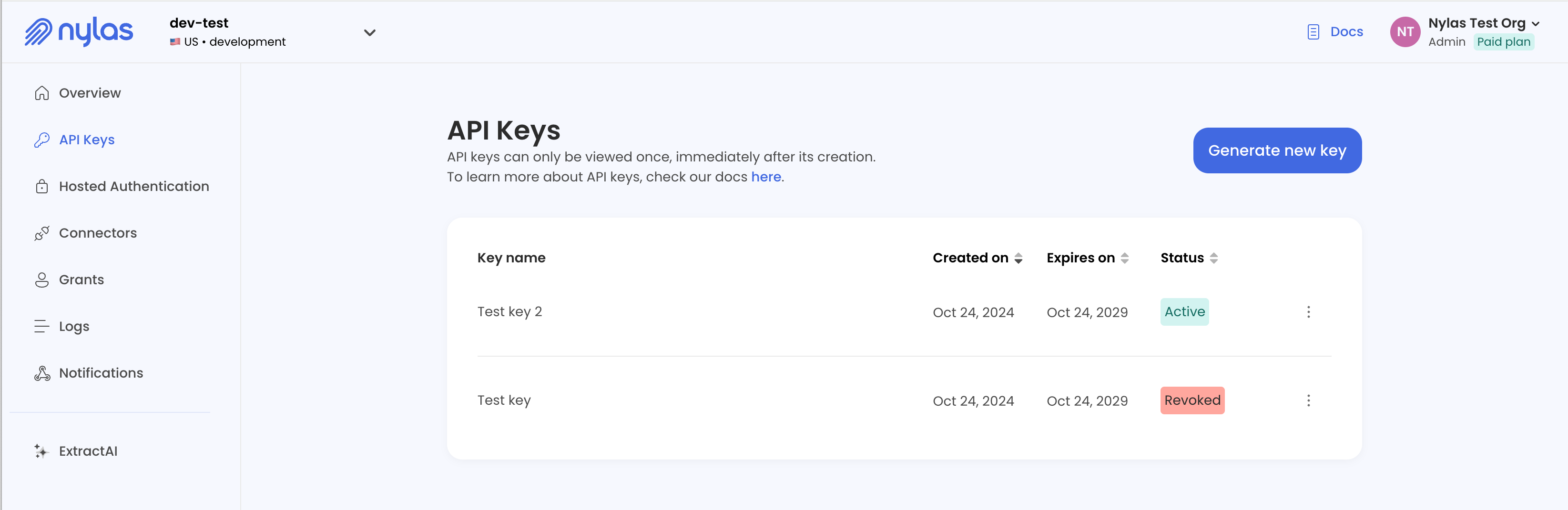 The v3 Nylas Dashboard showing the API Keys page for a Development application. Two API keys are listed. One is active, and one is revoked.